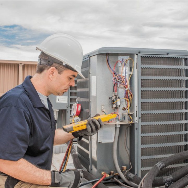 Clinton Heating & Cooling HVAC technician on a service call in Clinton, Ontario
